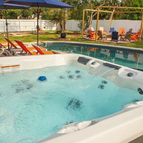 Spend your days poolside and your evenings soaking in the hot tub under the glow of the outdoor lights.
