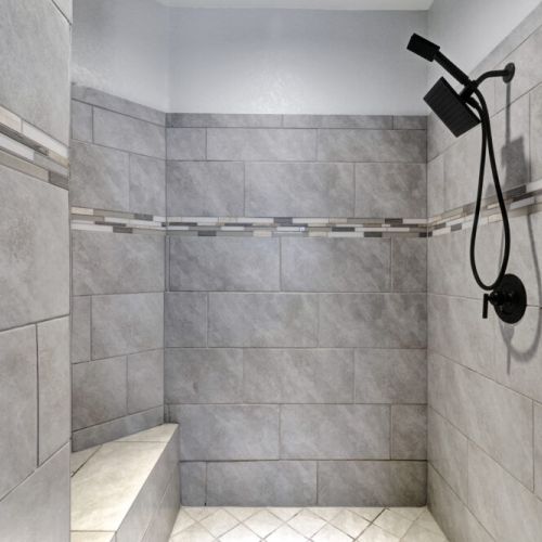 Elegant walk-in shower with rain shower included.