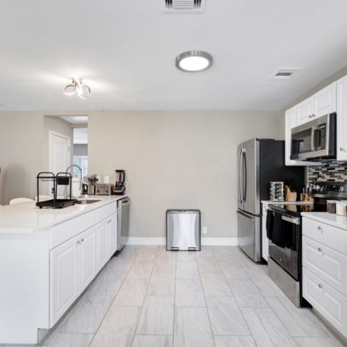 Stainless steel appliances. Fridge dispenses water and ice.