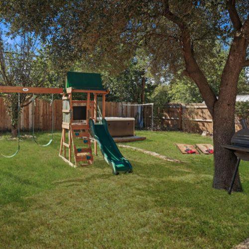 Savor the joy of cooking alfresco with our charcoal grill, creating delicious meals while enjoying quality moments with your family and friends in our amazing hot tub. Plus, we include a swing set for the little ones and a cornhole set!