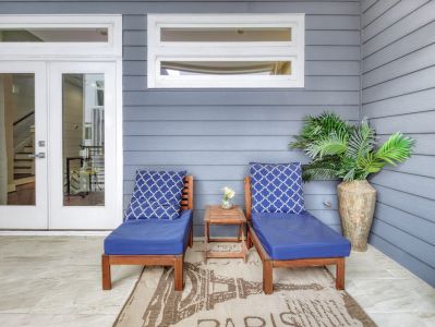 Relax outdoors in this inviting balcony with comfortable lounge chairs