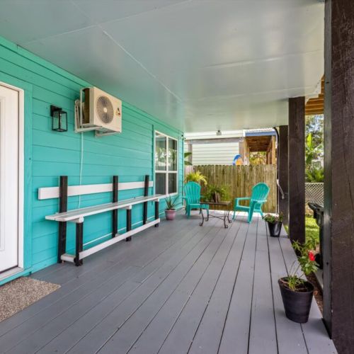 Step out onto this lovely porch to get some fresh air or a fresh morning coffee
