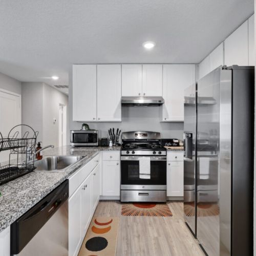 Fully equipped kitchen with high quality granite countertops.