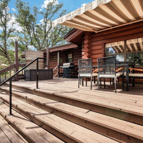 A beautiful outdoor dining setup where rustic charm meets comfort—perfect for morning coffee or dinner at sunset.