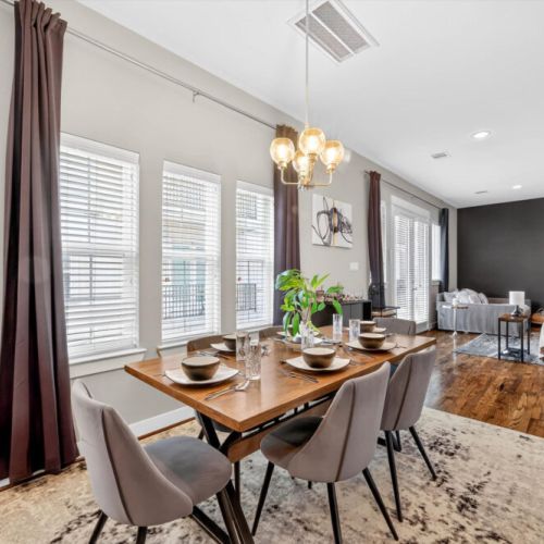 Spacious dining table that sits 6 with full tableware and silverware included.