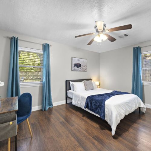3rd bedroom with queen size bed. Desk and comfortable chair included.