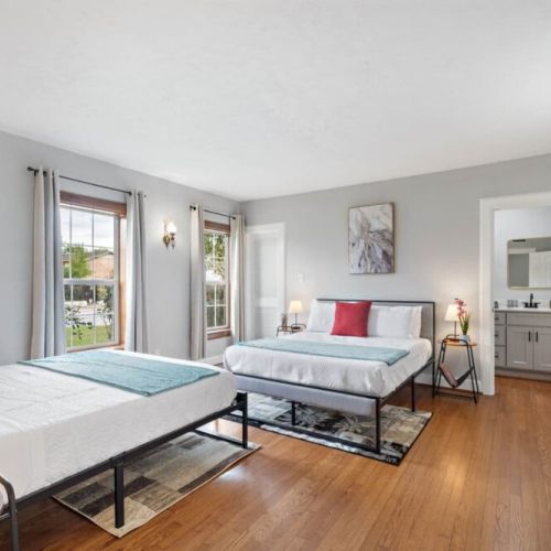 Primary bedroom with two queen size beds! Super comfortable memory foam mattresses.