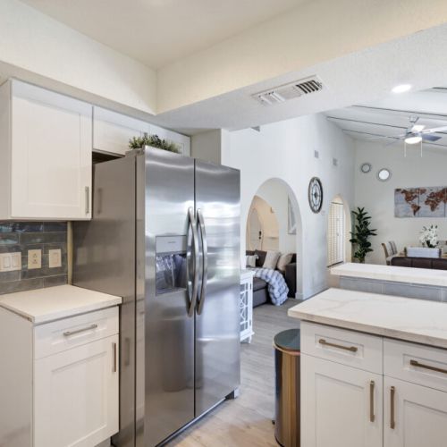 Stainless steel appliances. Fridge dispenses water and ice.