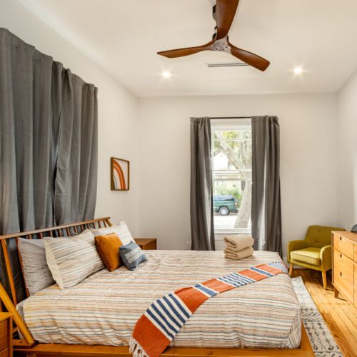 We include a cozy seating area with a full-length mirror.