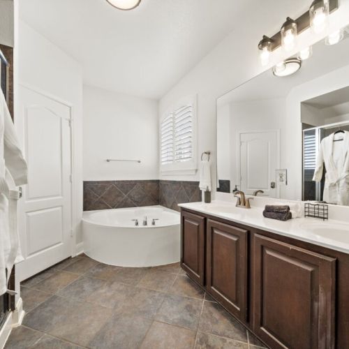 Primary bathroom is fully stocked with all you need. Makeup pads and q-tips included.