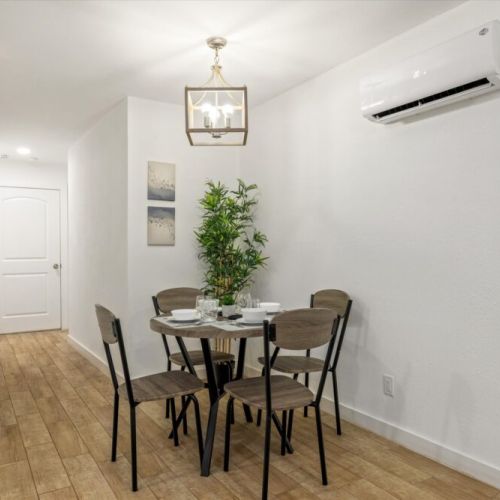 Charming dining table that sits 4 with full tableware and silverware included.