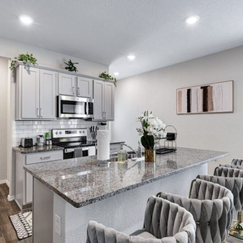 Kitchen island with 4 bar stools for your convenience.