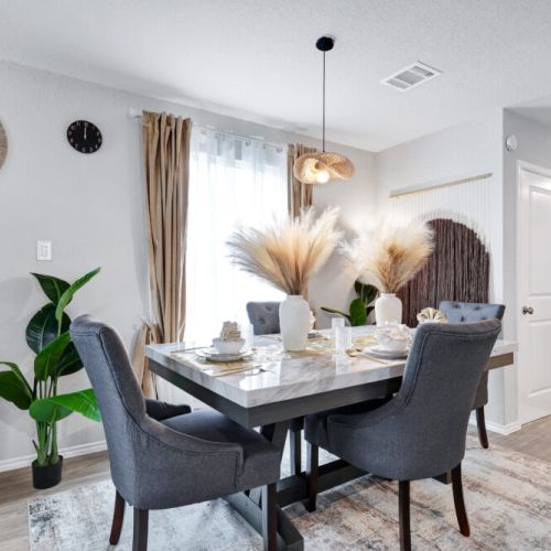 Spacious main dining table that sits 4 with full tableware and silverware included.