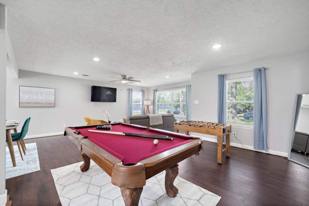Full-size pool table and foosball table included.