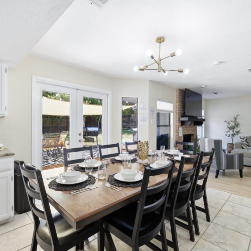 Spacious dining table that sits 8 with full tableware and silverware included.