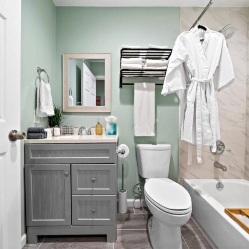 2nd full bathroom is fully stocked with all you need. White robes included.