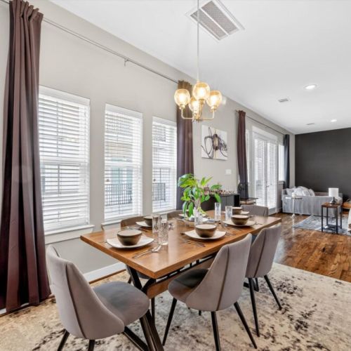 Spacious dining table that sits 6 with full tableware and silverware included.