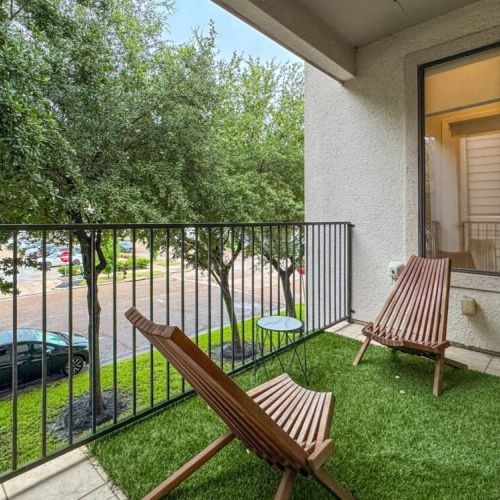 Cozy balcony with a beautiful view— perfect for enjoying a morning coffee.