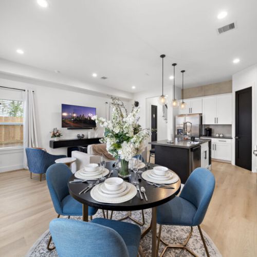 Spacious dining table that sits 4 with full tableware and silverware included.