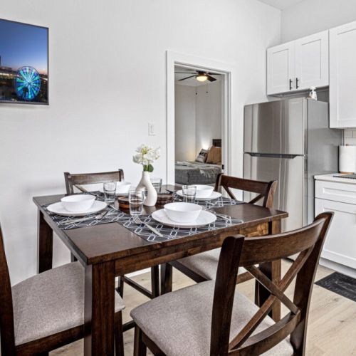 Charming dining table that sits 4 with full tableware and silverware included.