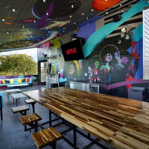 Outdoor dining table with smoker on the rooftop deck... Dine al fresco with a view.