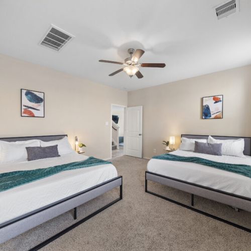 Primary bedroom with 2 queen size beds.