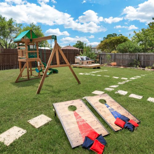Let the kids run wild in our awesome playhouse, then gather the whole crew for a friendly cornhole showdown!