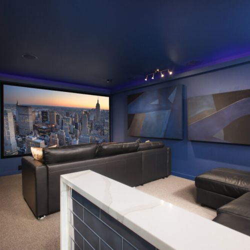 Catch your favorite shows in our movie theater, both couches pull out to beds