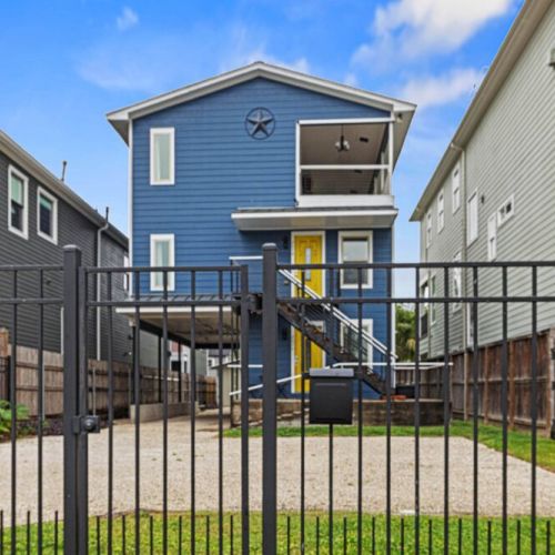 An exterior view of our lovely home. Can't wait to host you. The driveway gate does not lock or operate automatically; it must be opened and closed manually by pushing or pulling.