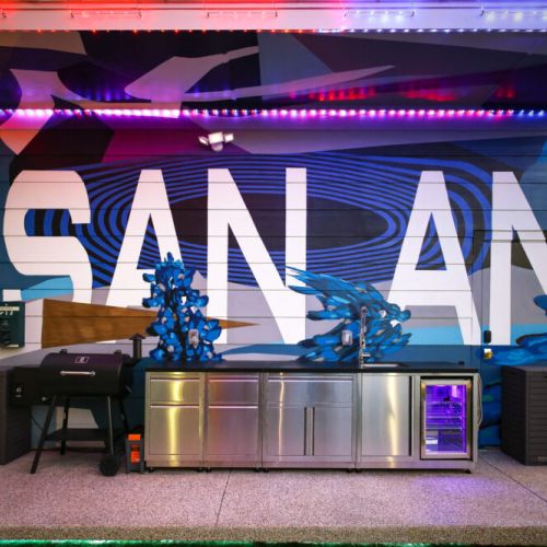 Outdoor kitchen with smoker, sink and mini fridge