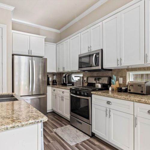 Fully equipped kitchen with high quality granite countertops.