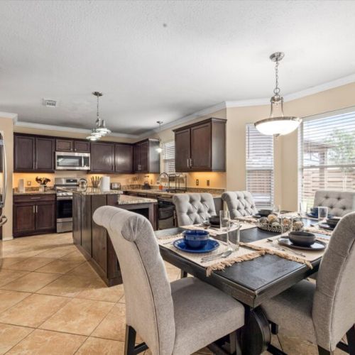 Spacious main dining table that sits 6 with full tableware and silverware included.