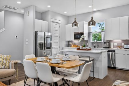 Spacious dining table that sits 6 with full tableware and silverware included.