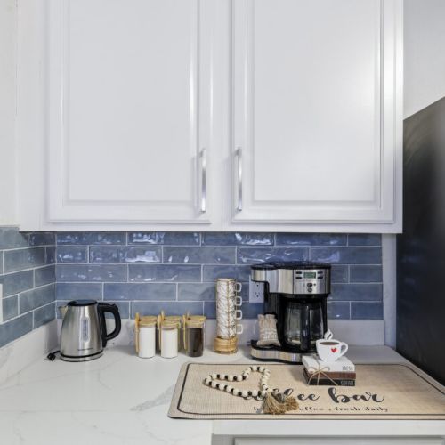 2-Way drip coffee machine with complimentary coffee, decaf, tea, sugar, cream, and sweetener