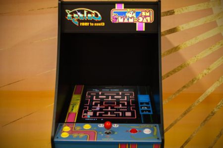 Bring out your competitive side with the arcade machine, perfect for some nostalgic fun.