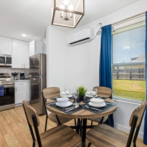 Charming dining table that sits 4 with full tableware and silverware included.