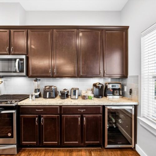 Keurig coffee machine + espresso machine with complimentary coffee, coffee pods, tea, sugar, cream, and sweetener