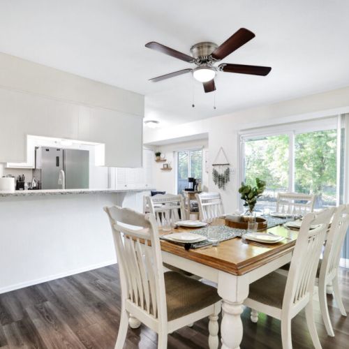 With a breakfast bar next to the dining table!