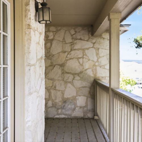 Cozy balcony with a beautiful view— perfect for enjoying a morning coffee.