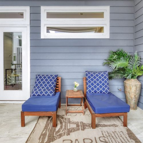 Relax outdoors in this inviting balcony with comfortable lounge chairs