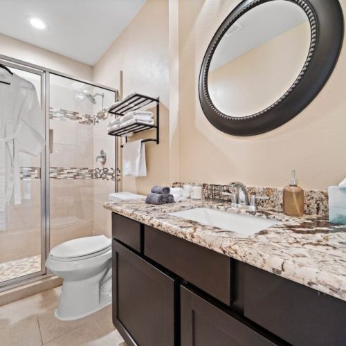 2nd full bathroom is fully stocked with all you need. White robes included.
