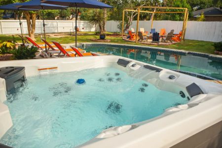 Spend your days poolside and your evenings soaking in the hot tub under the glow of the outdoor lights.