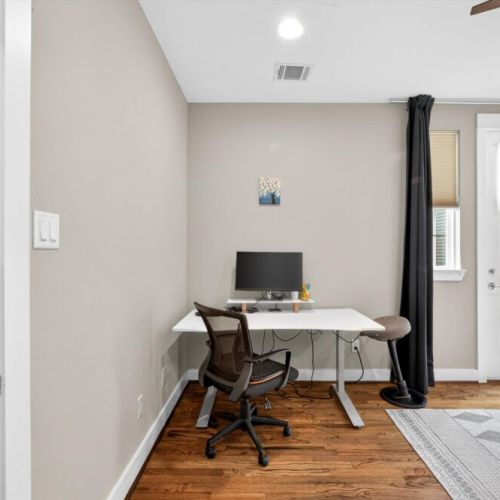 Do you need to finish some work? No problem, we got you covered! This is one of our dedicated workstations, equipped with a monitor, keyboard, and ergonomic chair