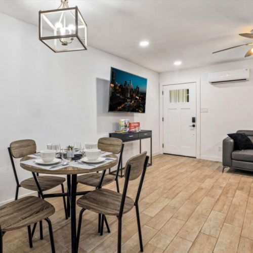 Charming dining table that sits 4 with full tableware and silverware included.