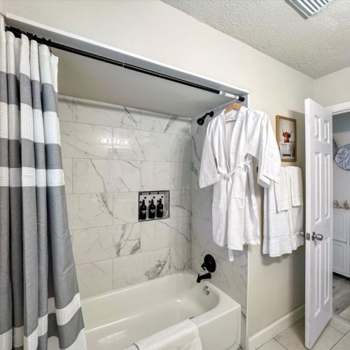 White robes included. Shampoo, conditioner, body wash, and body soap included for maximum comfort.