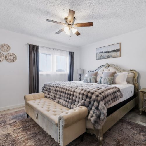 Primary bedroom with king size bed. 
We have added a comfortable bench for your comfort.