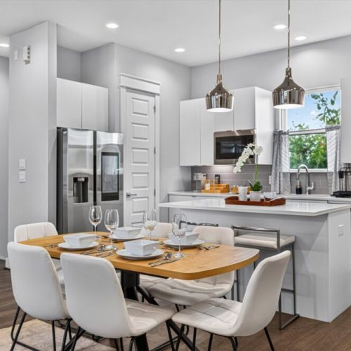 Spacious dining table that sits 6 with full tableware and silverware included.