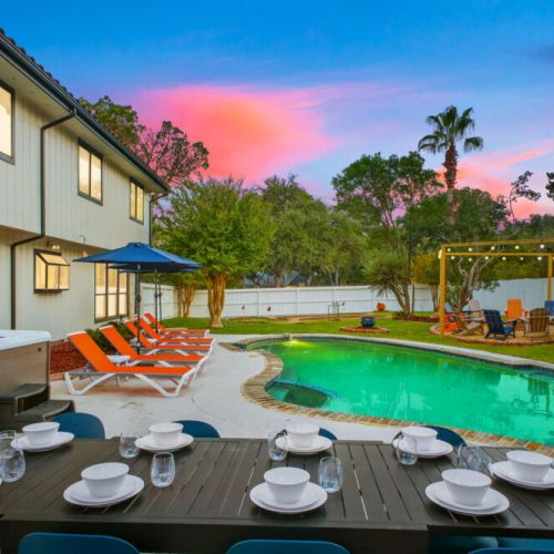 Enjoy an outdoor meal with your group at the table for 10, overlooking the sparkling pool and spacious backyard.