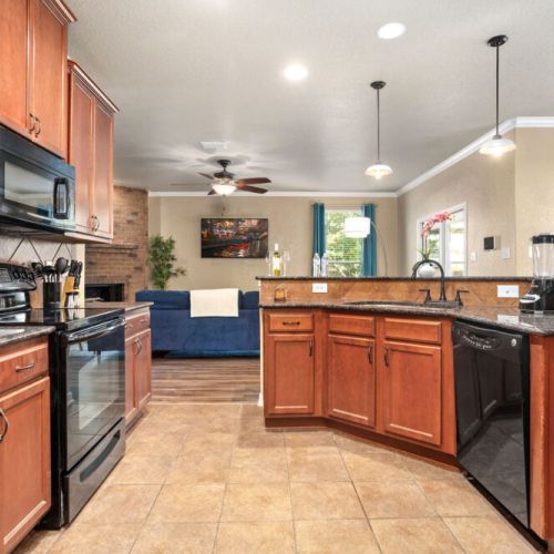 Fully equipped kitchen with high quality granite countertops.