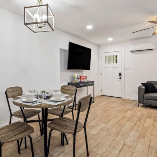 Charming dining table that sits 4 with full tableware and silverware included.